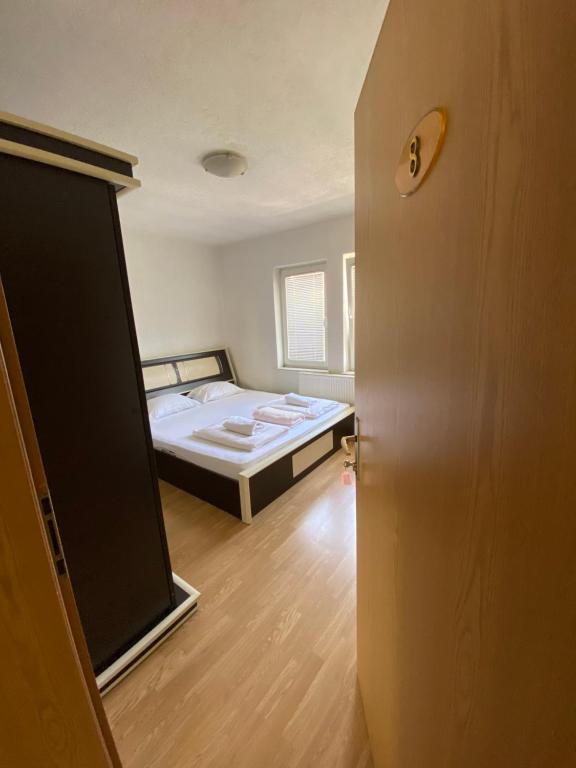 Postel nebo postele na pokoji v ubytování Bus Station Hostel