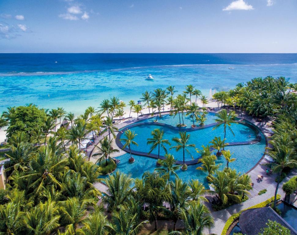 an aerial view of the pool at the excellence punta cana resort at Trou aux Biches Beachcomber Golf Resort & Spa in Trou aux Biches
