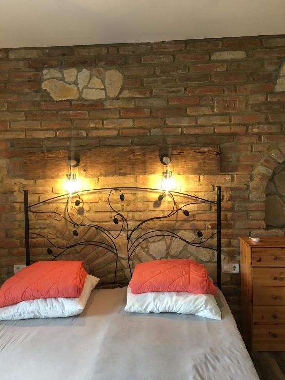 Posteľ alebo postele v izbe v ubytovaní Cuki Apartmanok