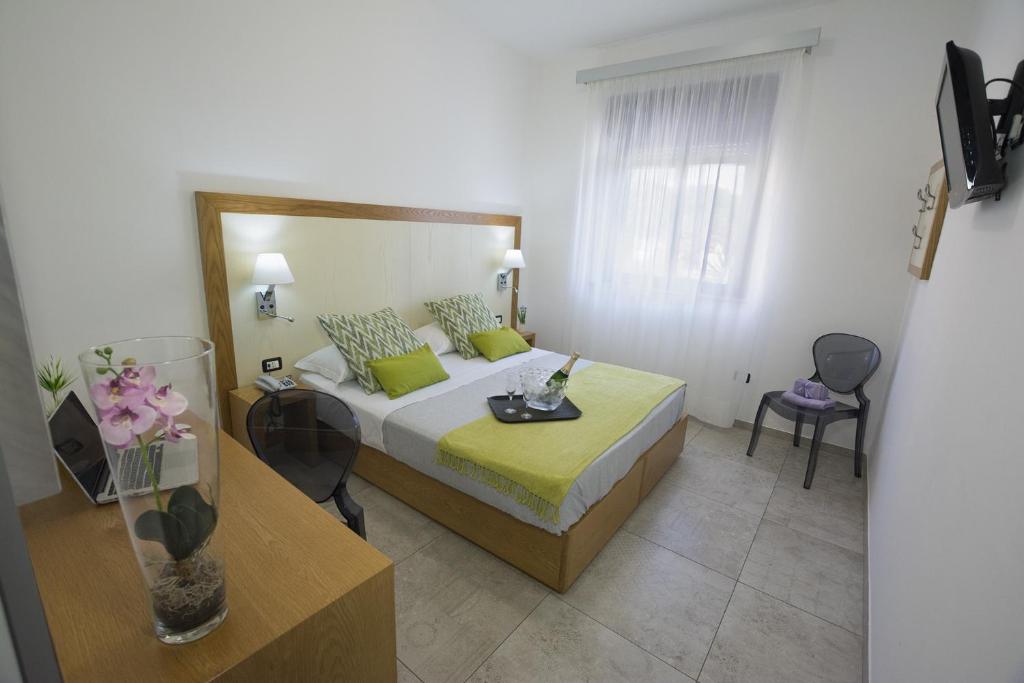 a hotel room with a bed and a table at Best Western Hotel Martello in Lampedusa