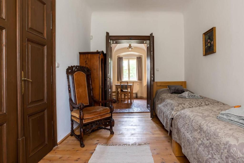 Postel nebo postele na pokoji v ubytování Ambrožův dvůr