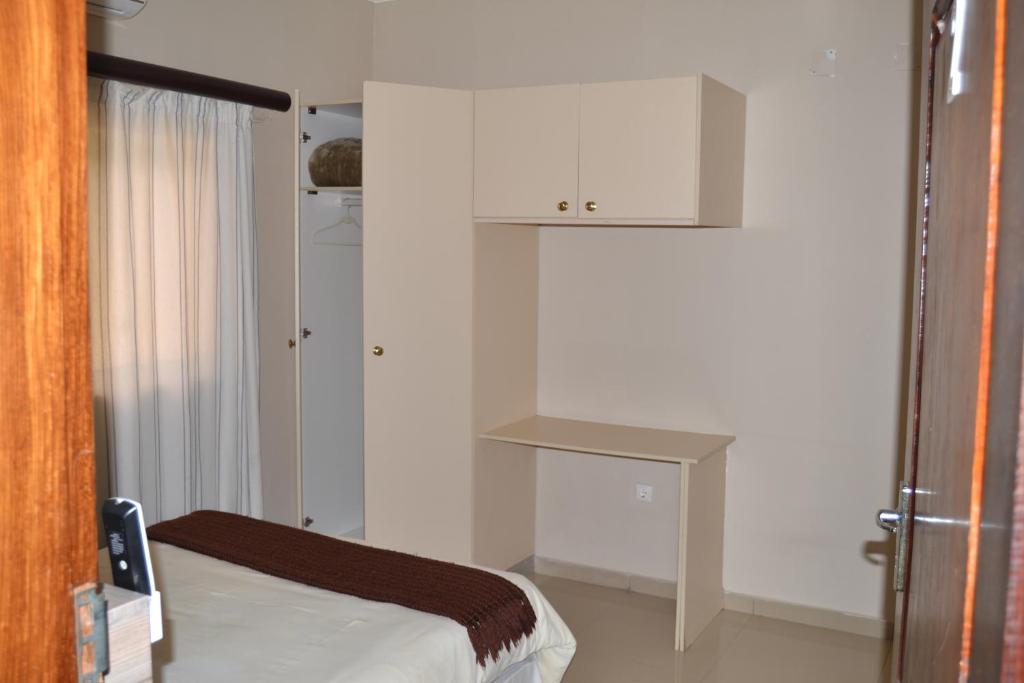 Postel nebo postele na pokoji v ubytování Ponta View Hotel