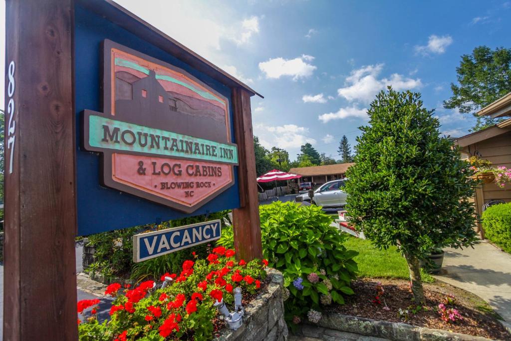 a sign for a mountain inn and ice castles at Mountainaire Inn and Log Cabins in Blowing Rock