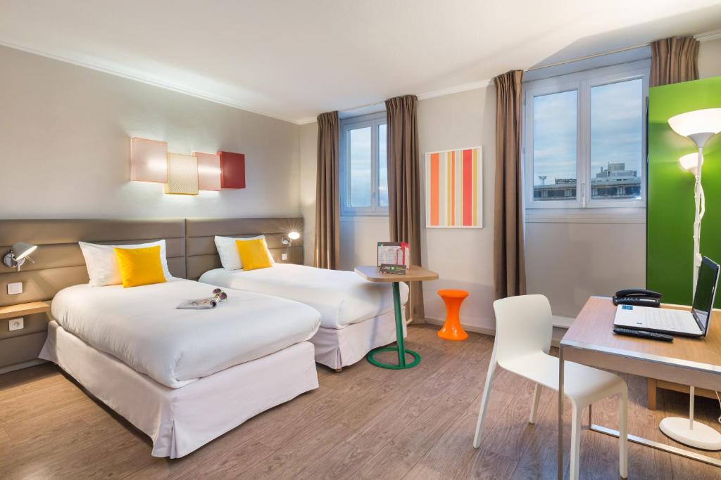Postel nebo postele na pokoji v ubytování Matabi Hotel Toulouse Gare by HappyCulture