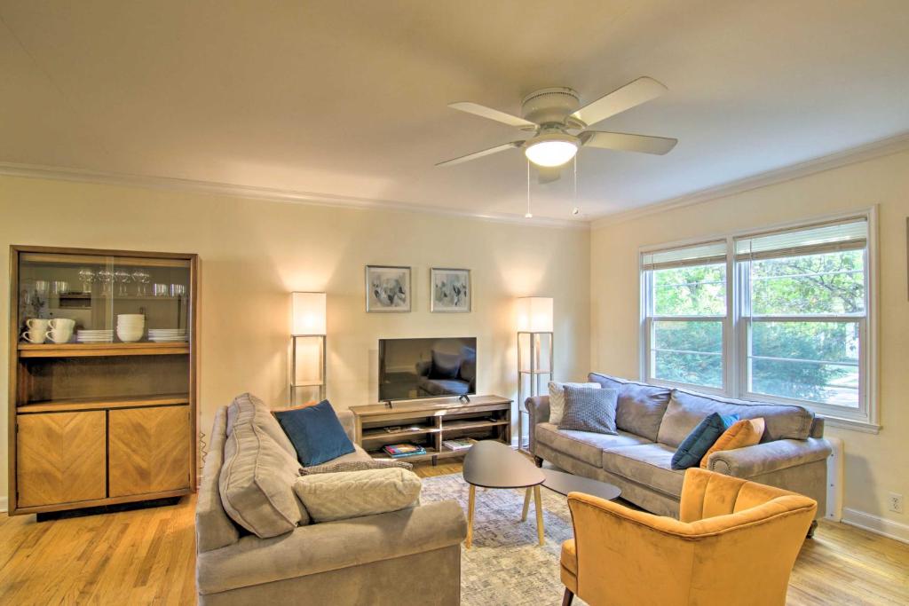 a living room with two couches and a ceiling fan at Mid-Century Bozeman Townhome about 1 Mi to Dtwn! in Bozeman