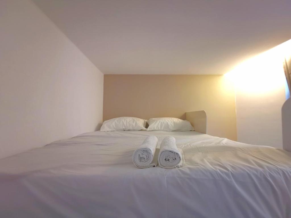 Postel nebo postele na pokoji v ubytování Maco Inn Austin Heights @Johor Bahru