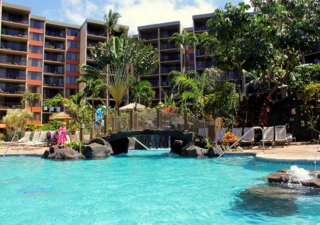a pool at a resort with a water slide at Kaanapali Shores Condominiums by TS in Lahaina