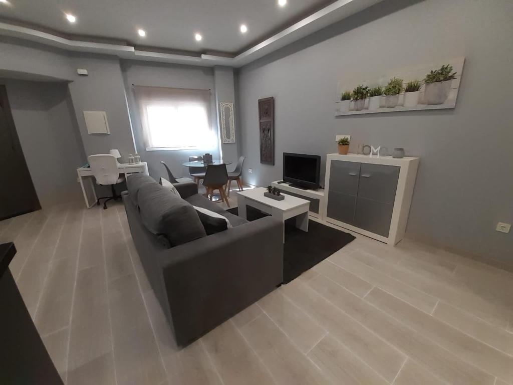 Televízia a/alebo spoločenská miestnosť v ubytovaní Apartamento Casa Lozano
