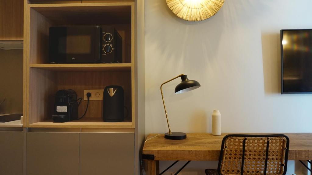 Telewizja i/lub zestaw kina domowego w obiekcie San Jorge Suites Triana