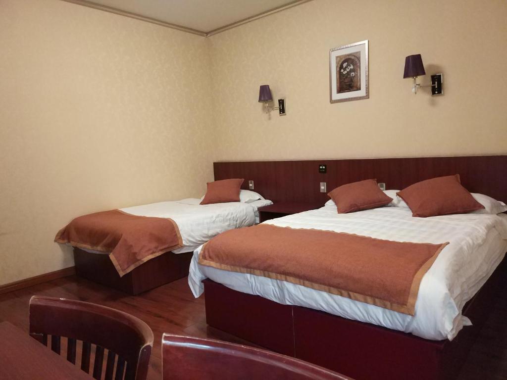 Postel nebo postele na pokoji v ubytování Hotel 198