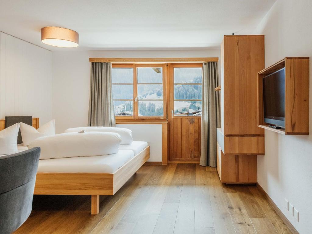Postel nebo postele na pokoji v ubytování Hotel Krüzli - dapi 1914