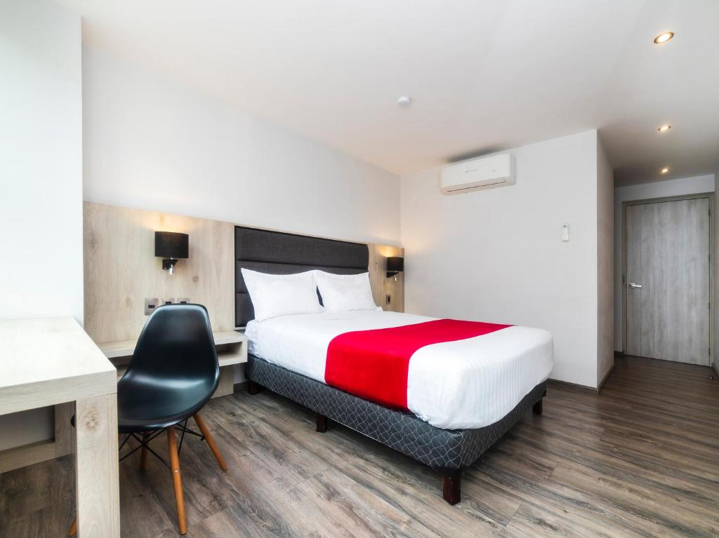 Ένα ή περισσότερα κρεβάτια σε δωμάτιο στο Hotel Nube