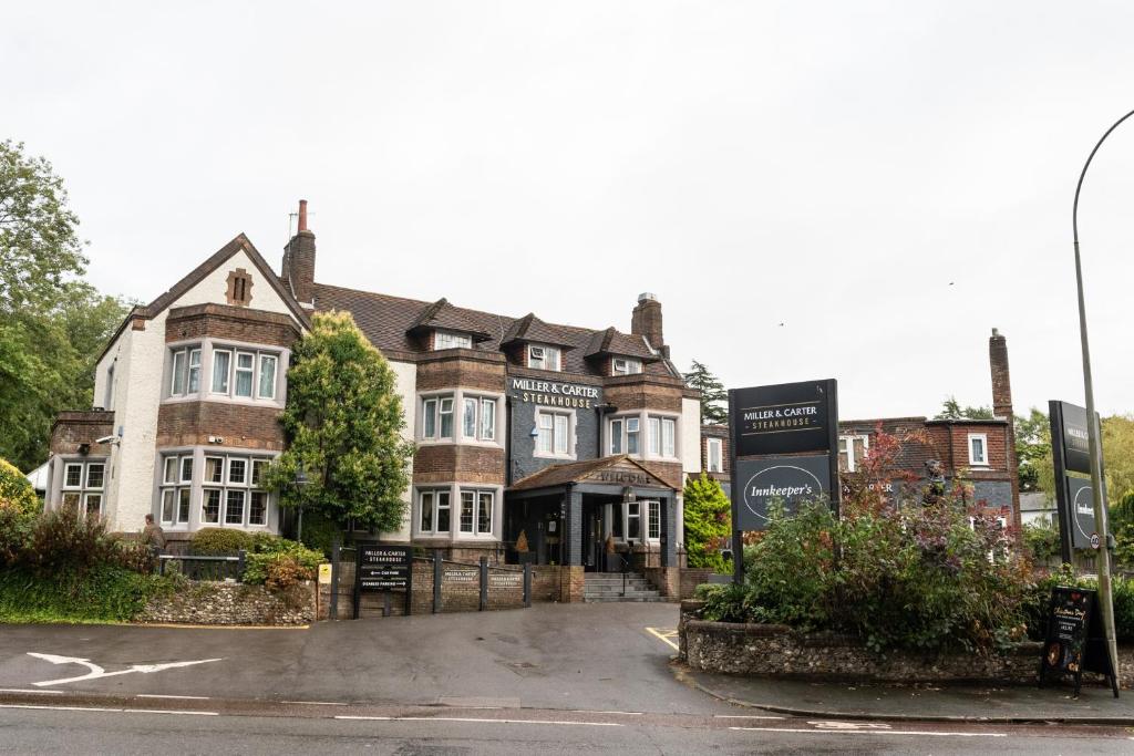 a large brick building with a sign in front of it at Miller & Carter Brighton by Innkeeper's Collection in Brighton & Hove