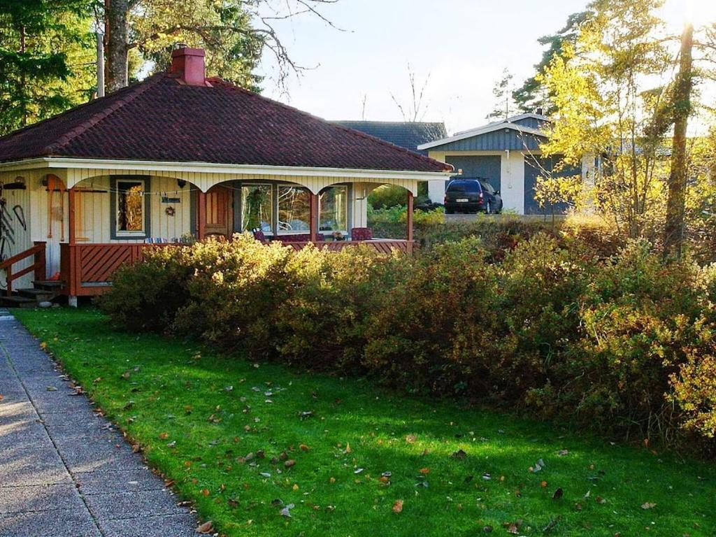 a house with a gazebo in a yard at 2 person holiday home in BENGTSFORS in Bengtsfors