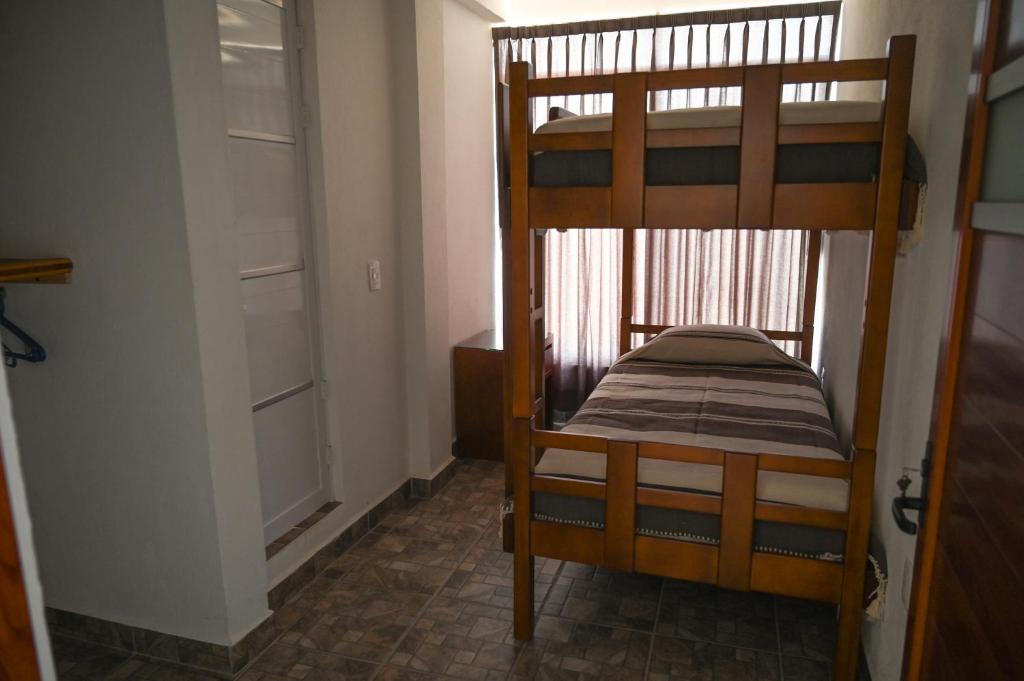 Postel nebo postele na pokoji v ubytování Casa LEONOR
