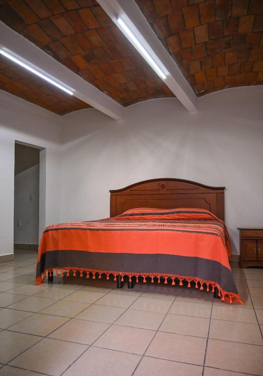 Postel nebo postele na pokoji v ubytování Casa LEONOR
