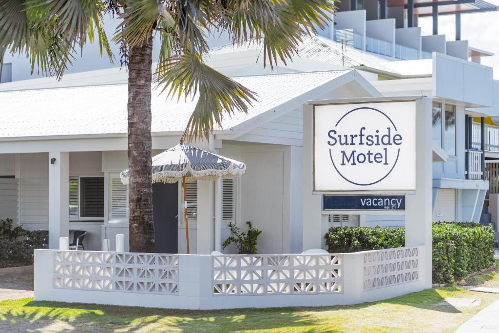 a motel sign in front of a house at Yeppoon Surfside Motel in Yeppoon