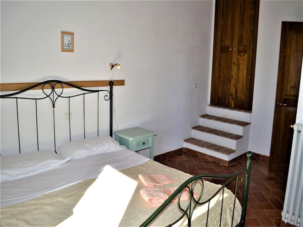 Łóżko lub łóżka w pokoju w obiekcie Holiday Apartment Close to Asciano