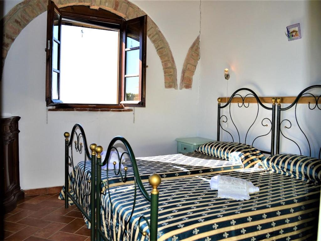 Łóżko lub łóżka w pokoju w obiekcie Holiday Apartment Close to Asciano