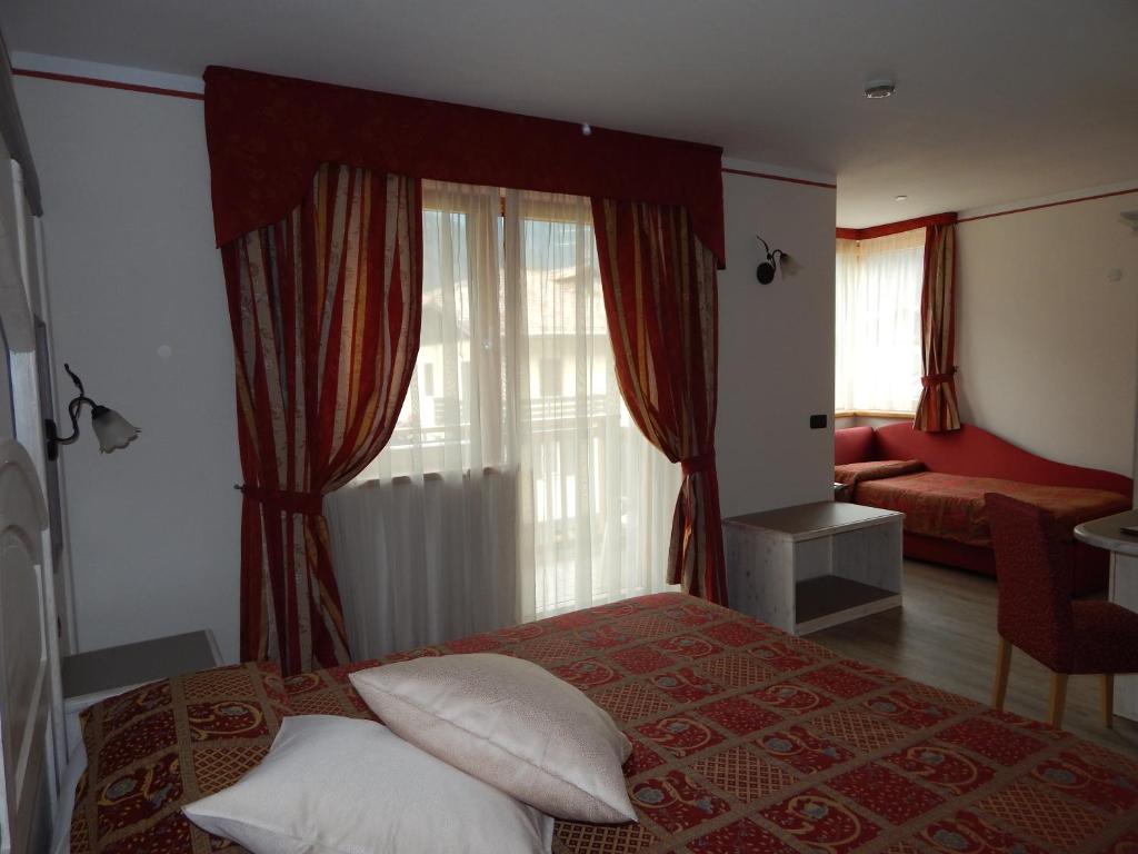 Postel nebo postele na pokoji v ubytování Hotel Canada