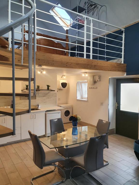 a kitchen and dining room with a table and chairs at Grange cottages in Edenderry