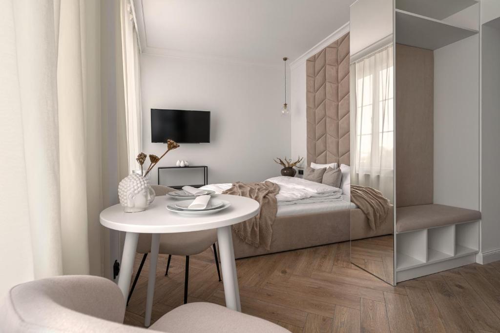 Posteľ alebo postele v izbe v ubytovaní APARTIO ROOMS Katowice