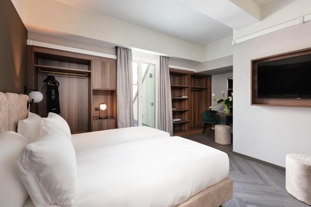 Postel nebo postele na pokoji v ubytování Hotel Tocq