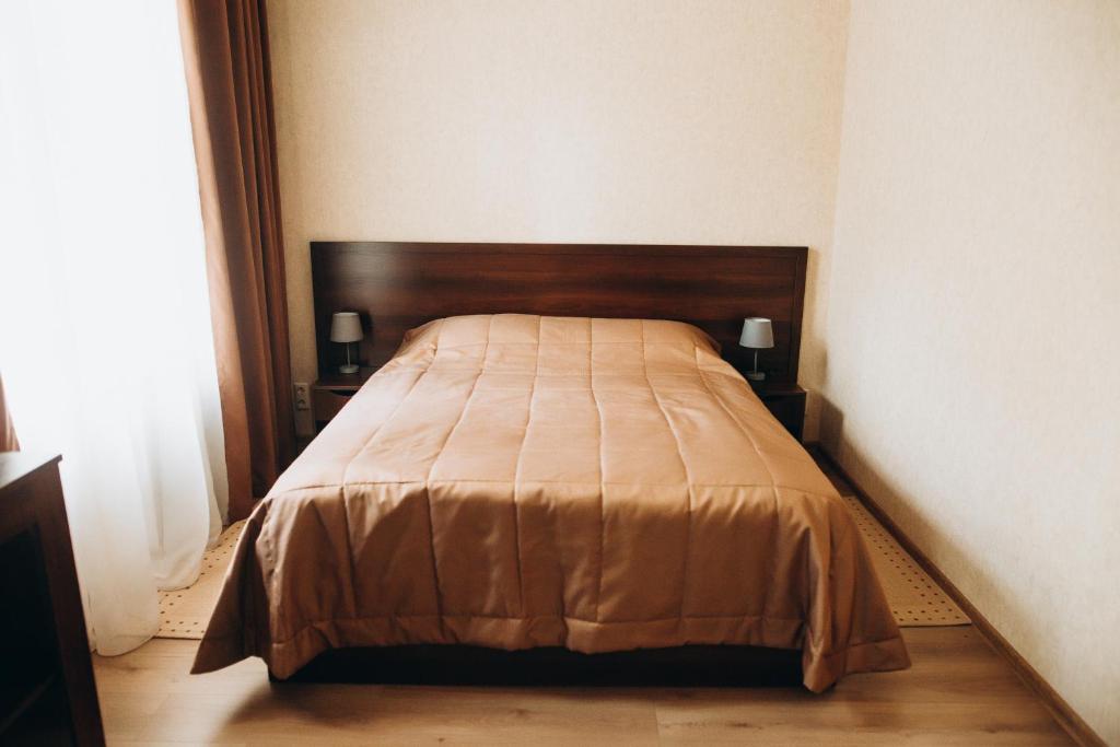 Postel nebo postele na pokoji v ubytování Oberig Hotel