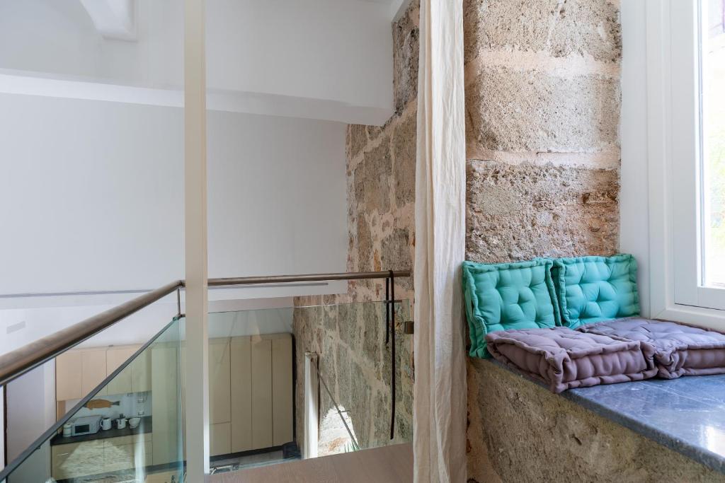 A bed or beds in a room at Valverde Art Space Loft by DomuSicily