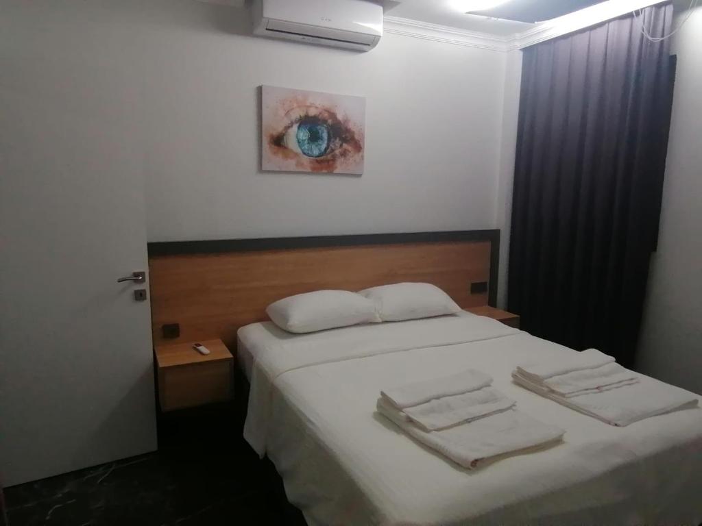 Postel nebo postele na pokoji v ubytování Sofya Suites
