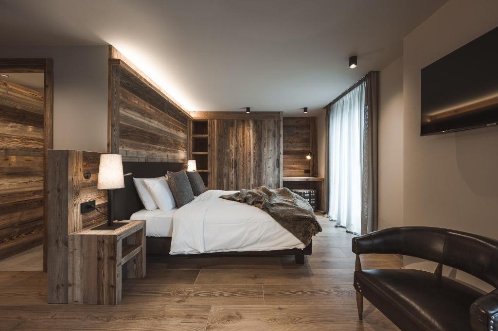 Posteľ alebo postele v izbe v ubytovaní Hotel Alù Mountain Design