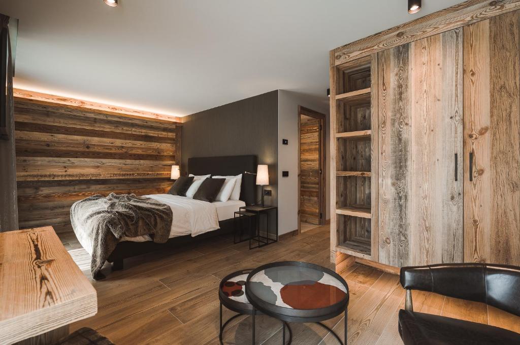 Posteľ alebo postele v izbe v ubytovaní Hotel Alù Mountain Design