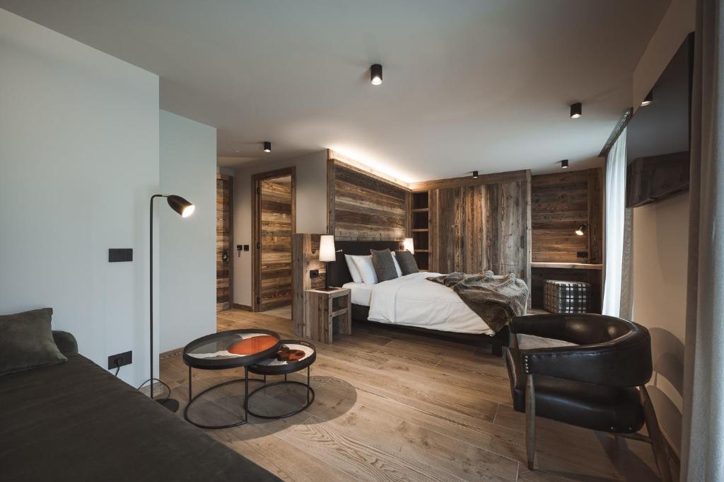 Posteľ alebo postele v izbe v ubytovaní Hotel Alù Mountain Design