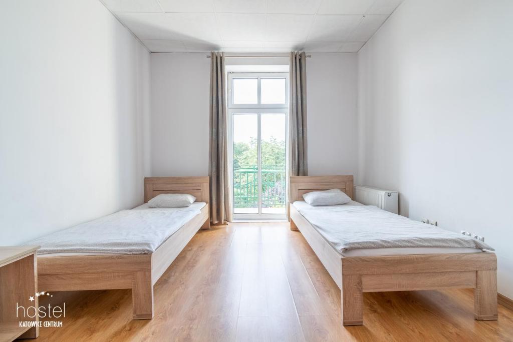 Postel nebo postele na pokoji v ubytování Hostel Katowice Centrum