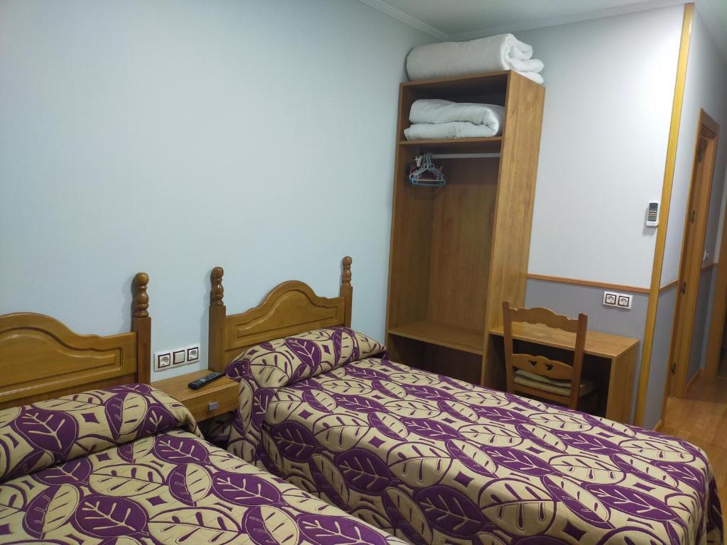 Posteľ alebo postele v izbe v ubytovaní Hostal Banderas