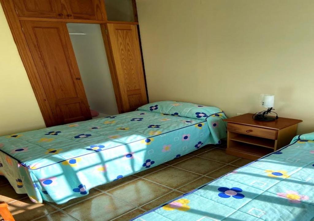 Postel nebo postele na pokoji v ubytování PANORAMIC VIEWS VALLE FRONTERA-WIFI-PREMIUM TV
