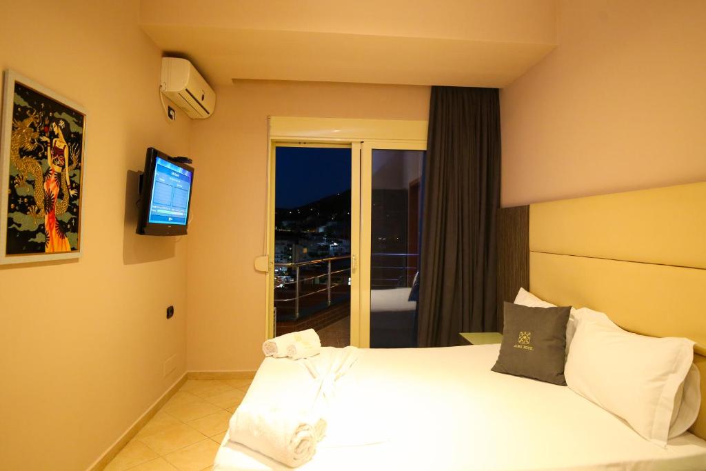 Postel nebo postele na pokoji v ubytování Aliko Hotel
