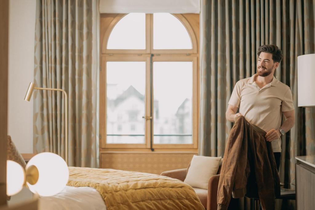 Postel nebo postele na pokoji v ubytování Hotel Märthof Basel