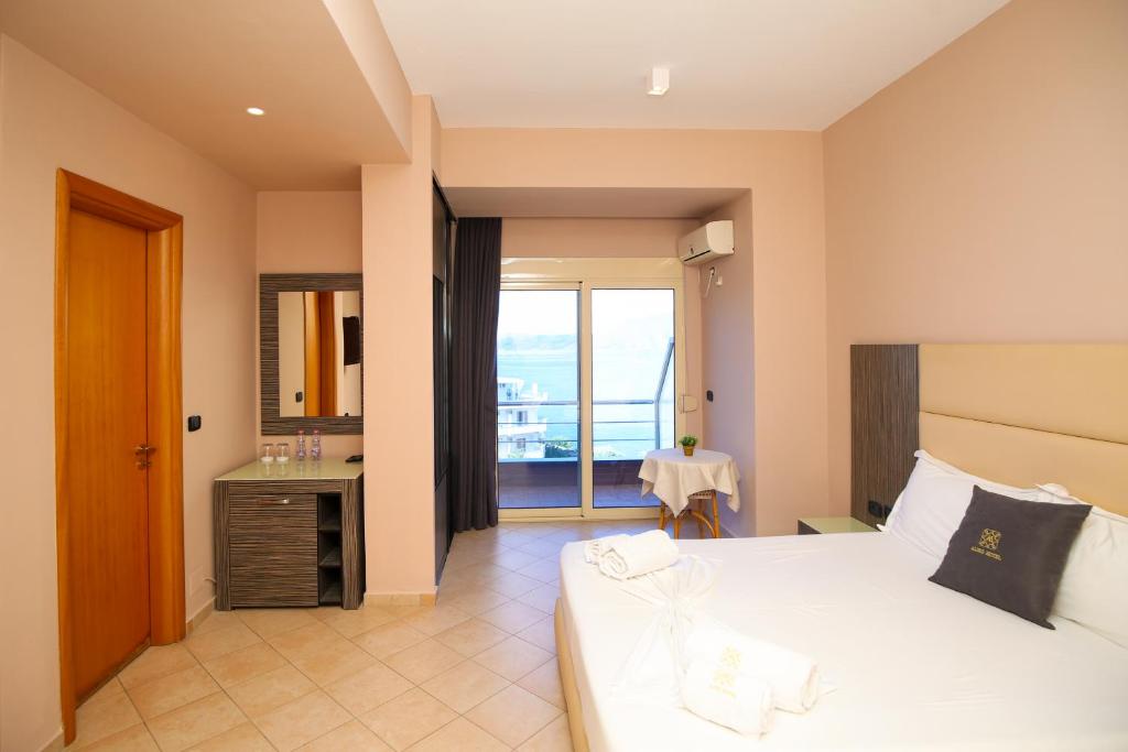 Postel nebo postele na pokoji v ubytování Aliko Hotel