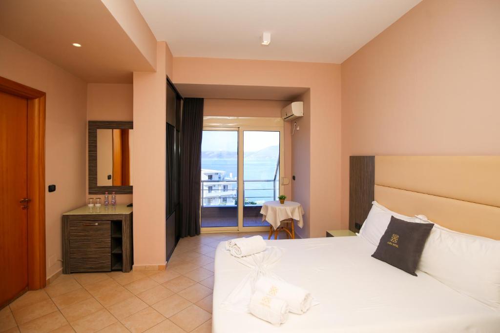 Postel nebo postele na pokoji v ubytování Aliko Hotel