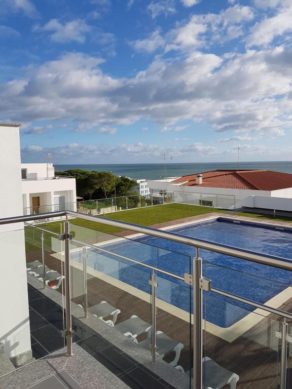 a balcony with a swimming pool on top of a building at Villa Amazing View - S in Albufeira