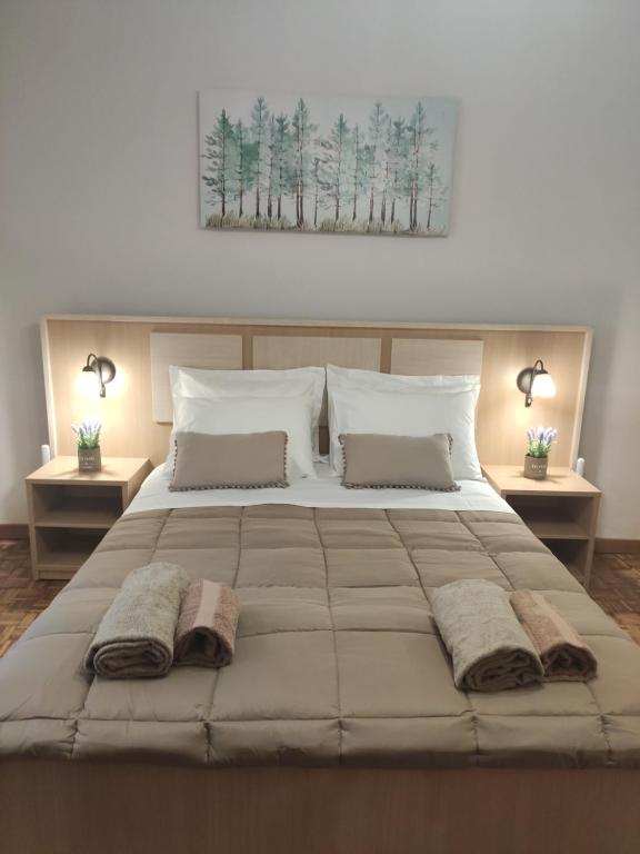 A bed or beds in a room at Gioiello di Corfu apartment