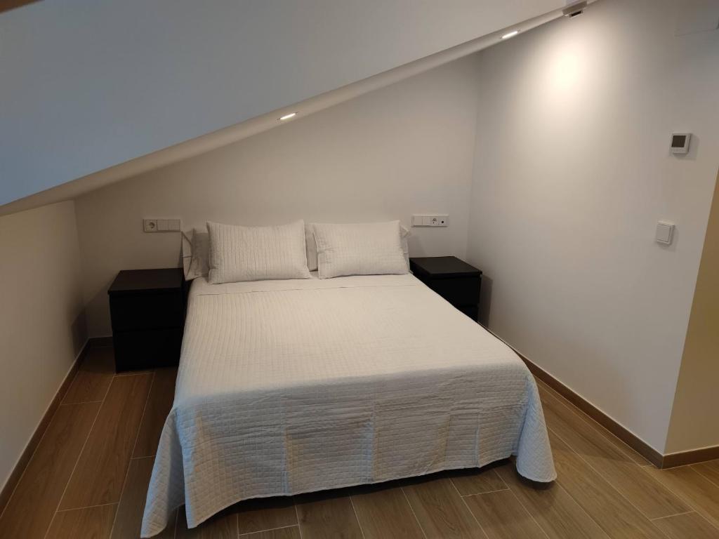 Posteľ alebo postele v izbe v ubytovaní Apartamentos A pousa do Asma