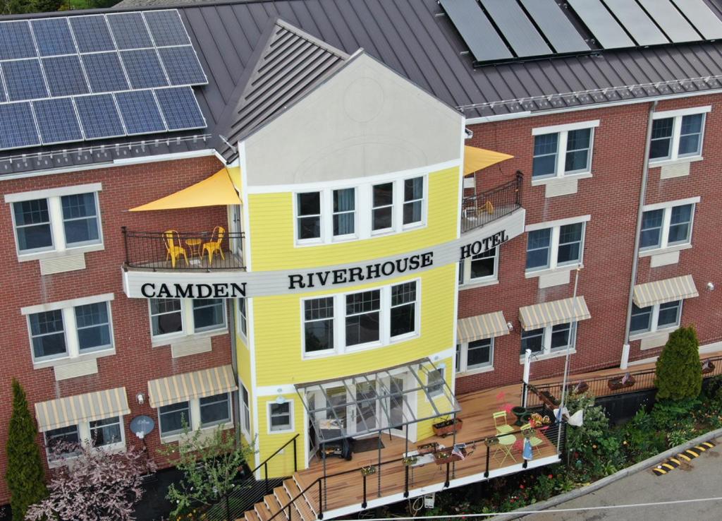 a rendering of a building with solar panels on it at Camden Riverhouse Hotel and Inn in Camden