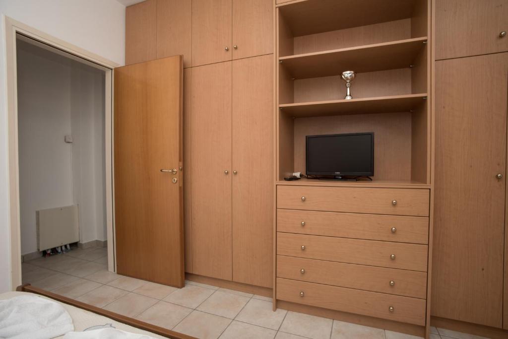 Telewizja i/lub zestaw kina domowego w obiekcie Olive Green Suite