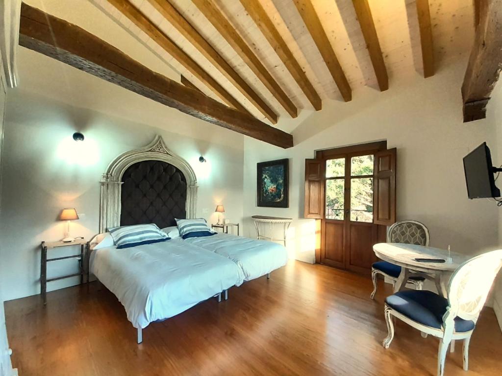 Postel nebo postele na pokoji v ubytování LA POSADA DEL TENOR