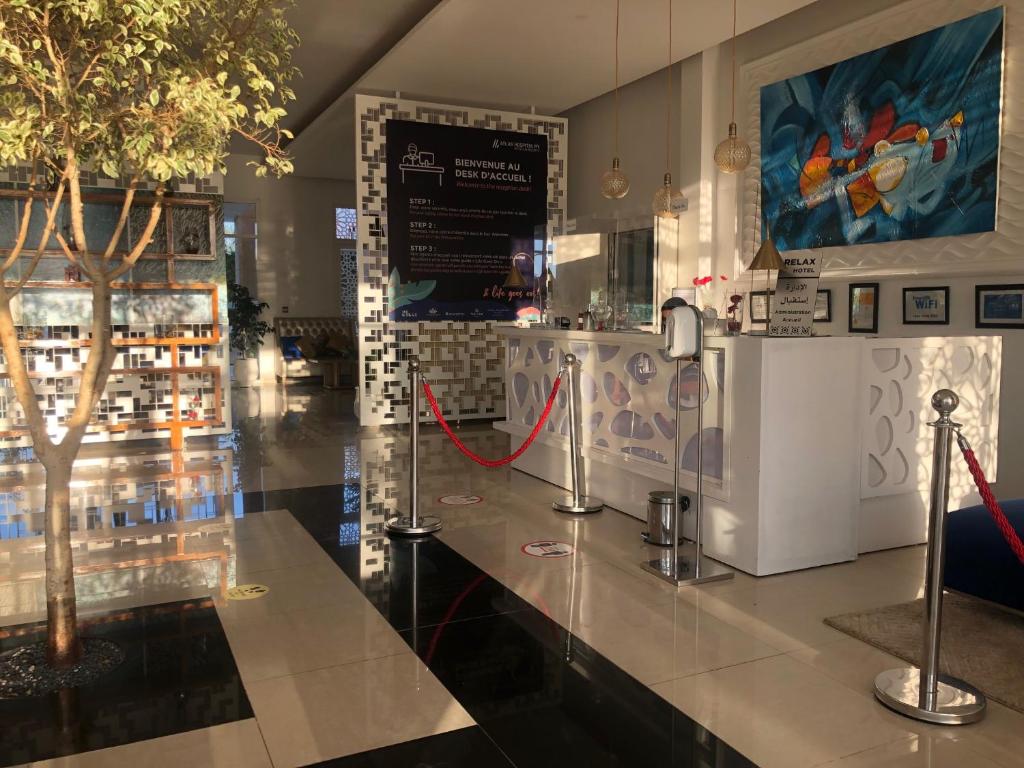 a store with a counter with a tree on it at Relax Hôtel Oujda in Oujda