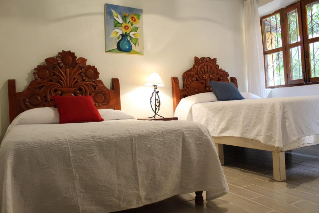 Un pat sau paturi într-o cameră la Hotel Sautto