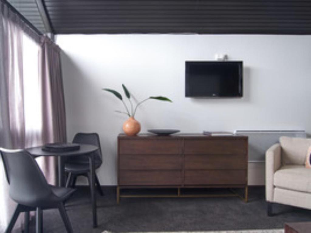 TV a/nebo společenská místnost v ubytování Hotel Carlton Mill