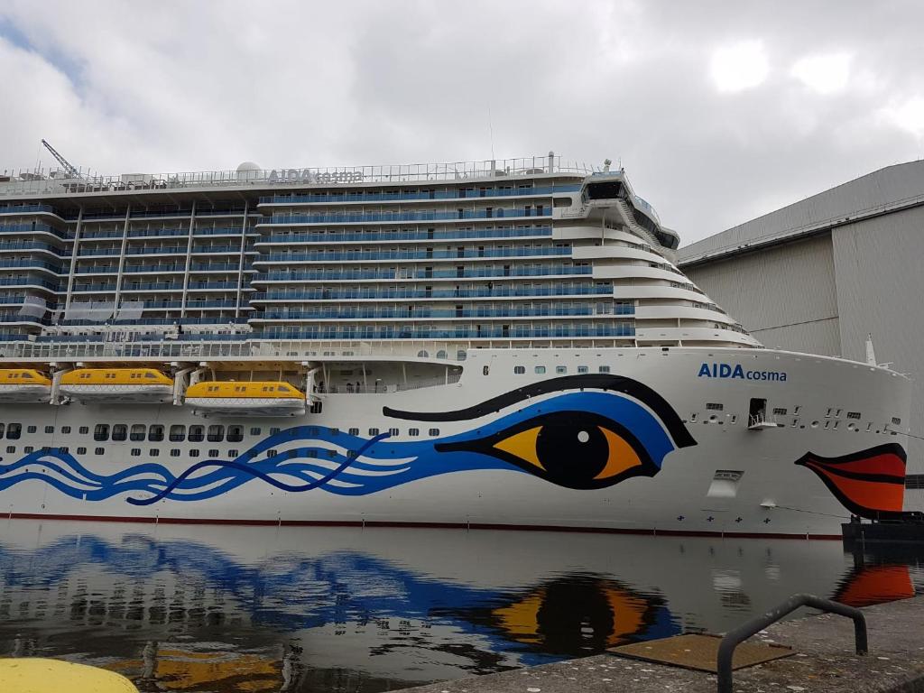 a cruise ship with an eye painted on the side at Deichhof in Westoverledingen